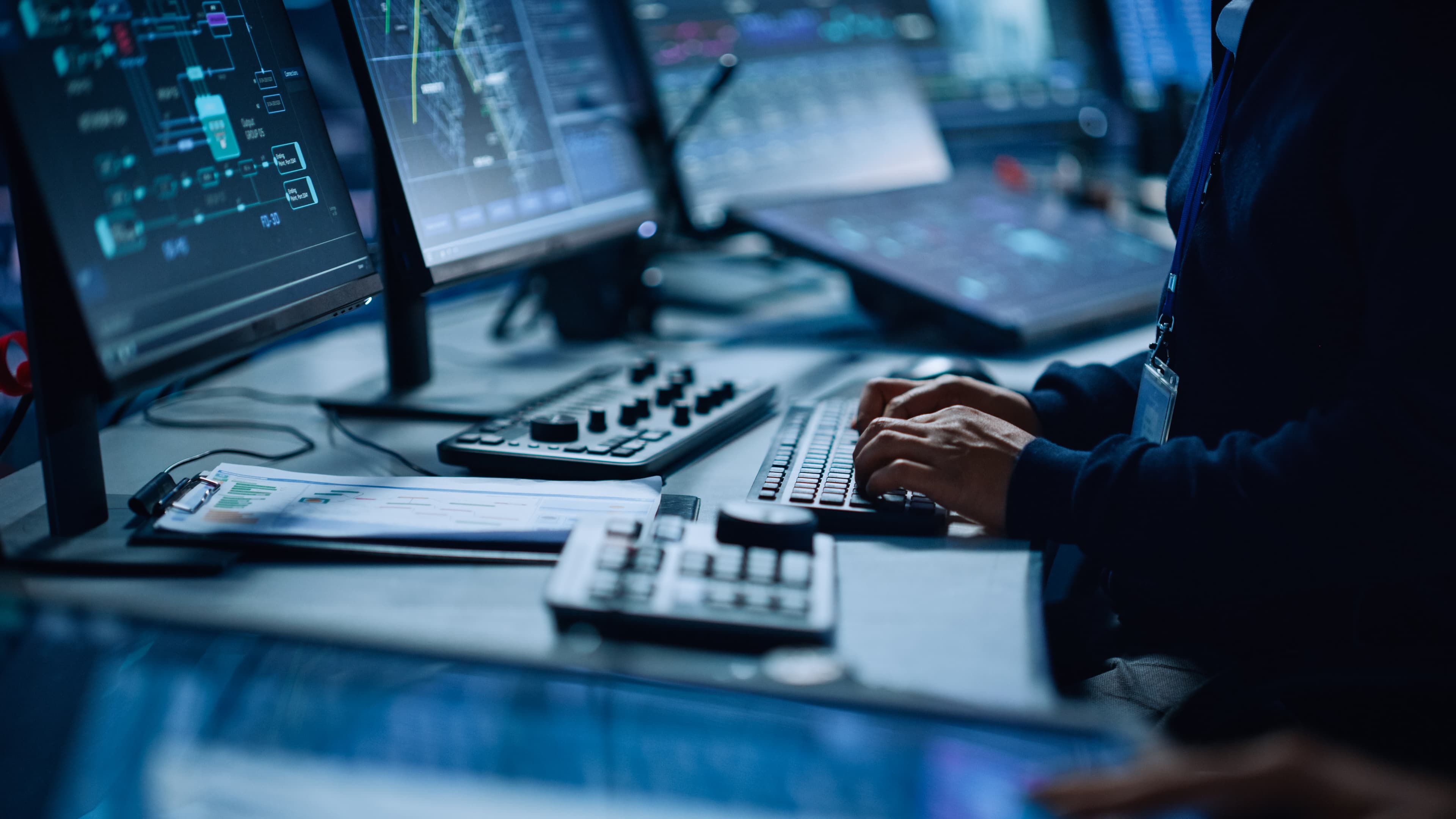 Man in front of computers